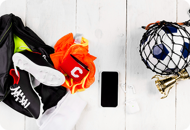 Sports retail gear arranged on a light surface